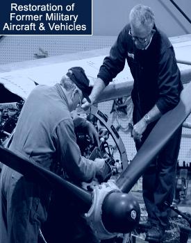 men restoring an old plane